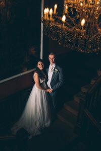 Bride and Groom on the stairs at Falcon Manor