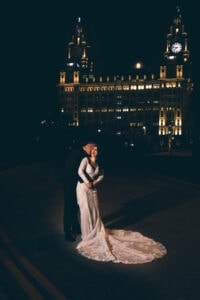 Bride and Groom in front of the Liver Building at Night