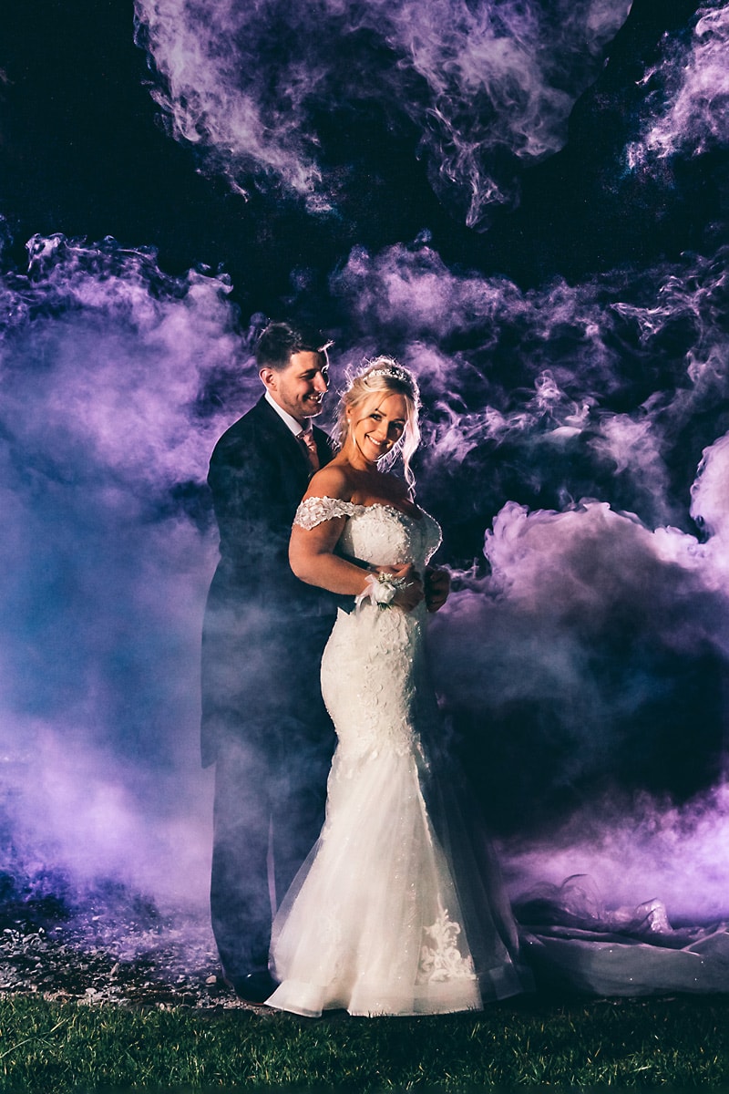 Bride and Groom with smoke Bombs at Beeston Manor