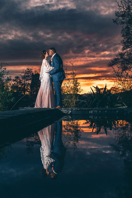 Bride and Groom infront of an amazing sunset at Broadoaks Country House
