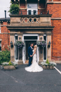 Bartle Hall Hotel Wedding Photography - bride and groom at front entrance