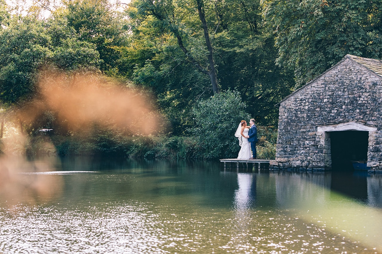 Bride and Groom by the fish pond at Browsholme Hall
