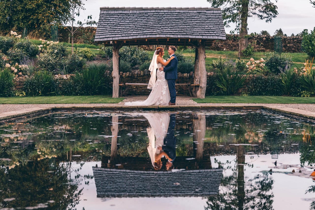 Bride and Groom by the lily pad pond