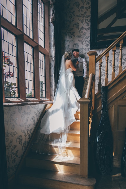Merrydale manor wedding photographer - Bride and Groom on the staircase